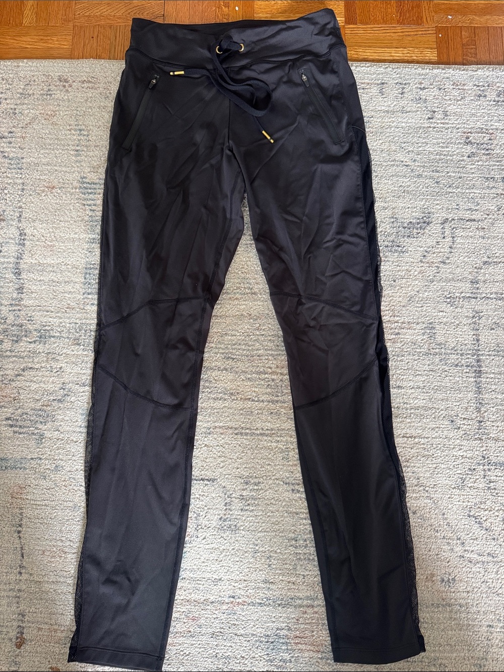 Alala Black Performance Leggings with Drawstring Waist & mesh sides